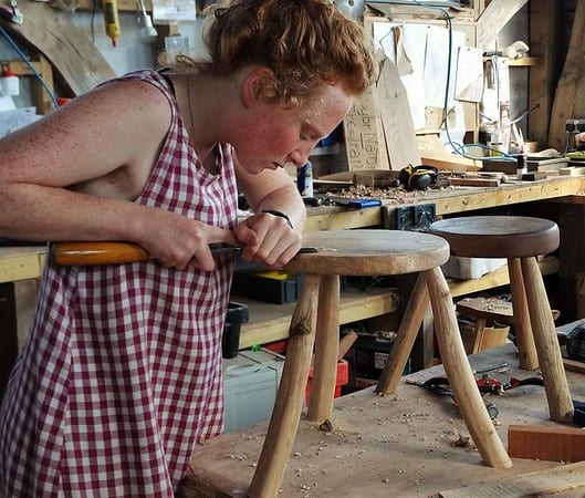 women carving wood